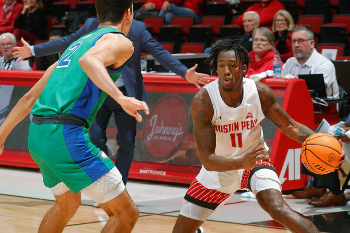 Austin Peay State University Men's Basketball junior Rodrique Massenat makes a move in the first half Thursday against Florida Gulf Coast. (Robert Smith, APSU Sports Information)