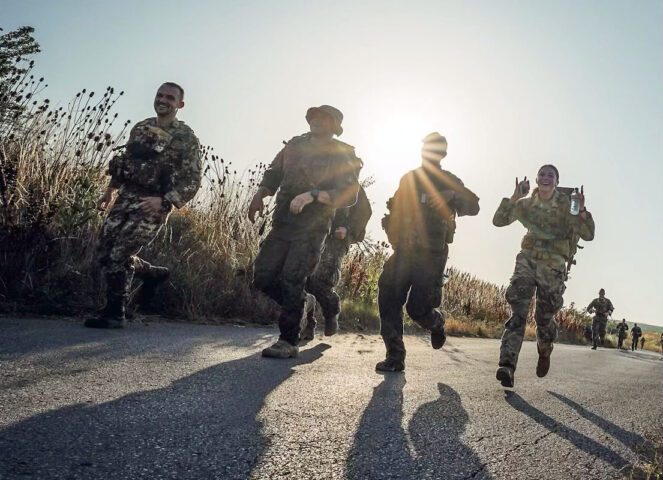 Blanchfield Army Community Hospital Physical Therapist Capt. Jennah Janney (right) participated in a Danish Contingent March during her recent deployment to Kosovo with the 547th Medical Company. Janney graduated the Sabalauski Air Assault School, Dec. 13, 2022 and said that 18.27 mile ruck march was one event that helped prepare her for the physical rigors of air assault school.