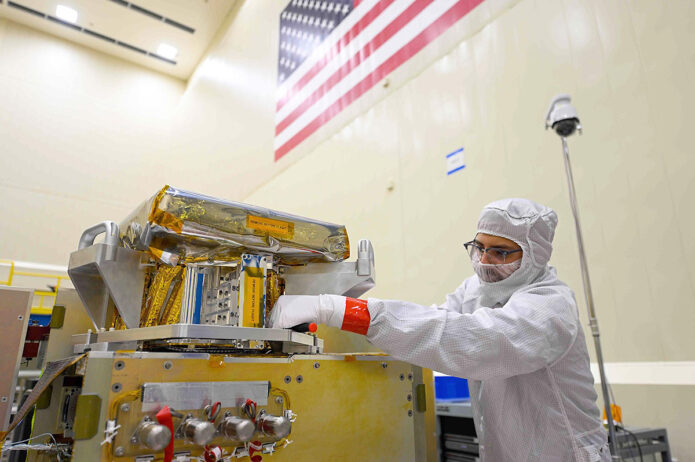 Engineers work on the JPL-developed High-resolution Volatiles and Minerals Moon Mapper (HVM3) for NASA's Lunar Trailblazer spacecraft in a clean room at Lockheed Martin Space in Littleton, Colorado, in December 2022. (Lockheed Martin Space)