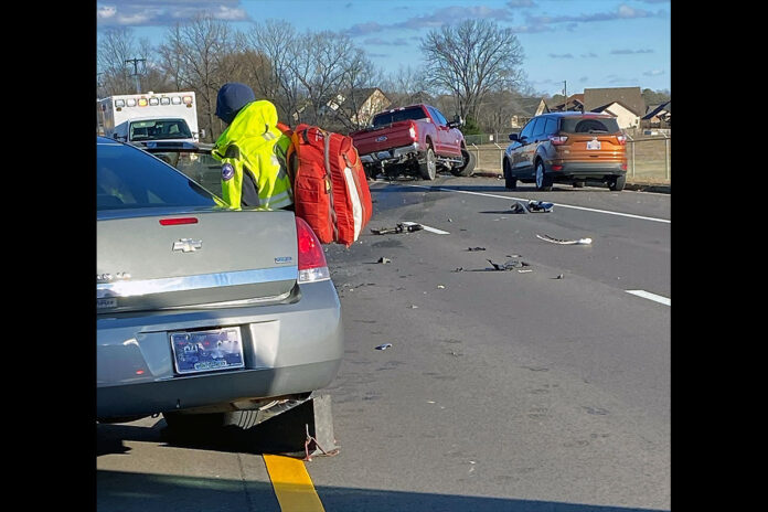 Clarksville Police Officers working a wreck with injuries on Tiny Town Road at Outlaw Field Road.