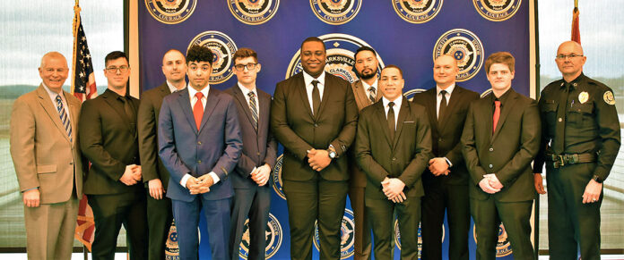 (L-R) Clarksville Mayor Joe Pitts, Joshua Siragusa, William Schwartz, Douglas Piecuski, Iziah Mazingo, Raymond Horton, Pono Frank, Demetrius Harris, Christopher Bush, Joseph Baggett, and Clarksville Police Chief David Crockarell.