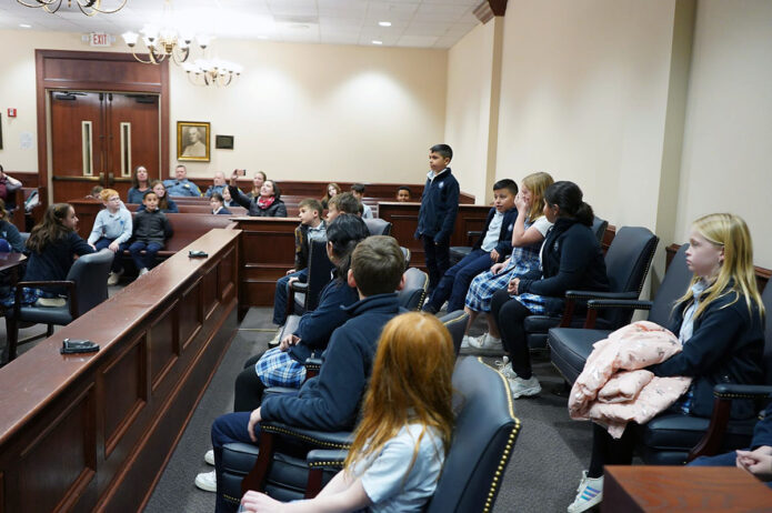 Fourth graders act out a mock trial in Montgomery County Courtroom.