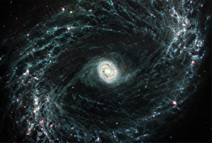 The Mid-Infrared Instrument (MIRI) on NASA’s James Webb Space Telescope took this image of NGC 1433, a barred spiral galaxy with a particularly bright core surrounded by double star-forming rings. The observations reveal cavernous bubbles of gas where forming stars have released energy. (NASA, ESA, CSA, and J. Lee (NOIRLab). Image processing: A. Pagan (STScI))