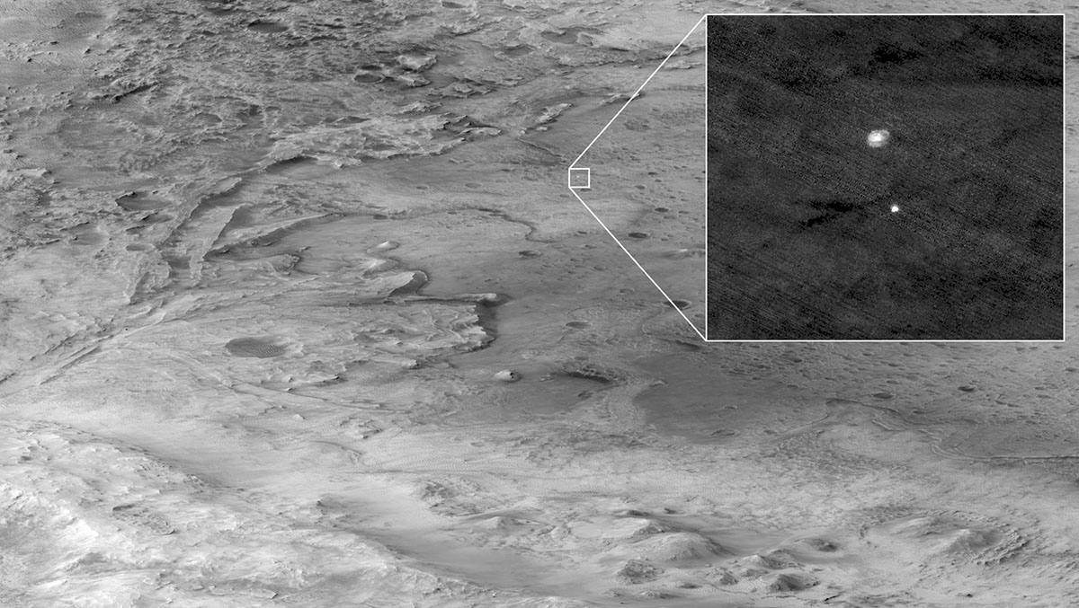 The descent stage holding NASAs Perseverance rover can be seen falling thorough the Martian atmosphere in this image taken on February 18th, 2021, by the HiRISE camera aboard the Mars Reconnaissance Orbiter. An ellipse indicates where Perseverance touched down. (NASA/JPL-Caltech/University of Arizona)