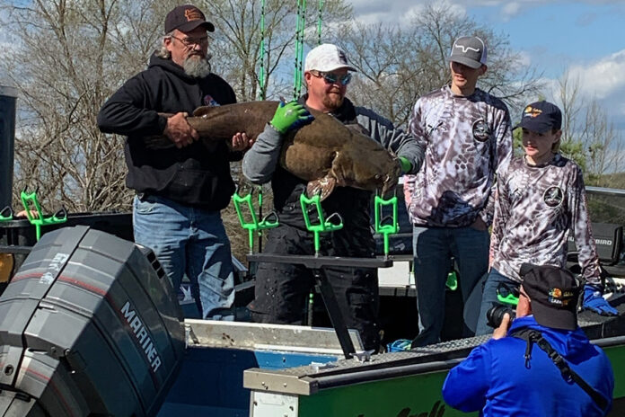 Competitors with their award-winning catfish.