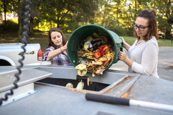 Austin Peay State Univesity student worker Leslie Warren helps Alexandra Wills, APSU's director of Community Engagement and Sustainability, with a composting project in 2017. (APSU)