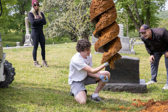 Austin Peay State University student Patrick Richardson helps collect soil samples at Riverview Cemetery. (APSU)