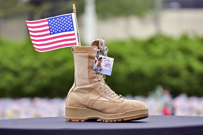Gold Star and surviving families, Soldiers and veterans gather to pay tribute to fallen service members during the 9th annual Boots on the Ground Display Ceremony, May 19th, at the 101st Airborne Division (Air Assault) Headquarters. (Kayla Cosby, Fort Campbell)