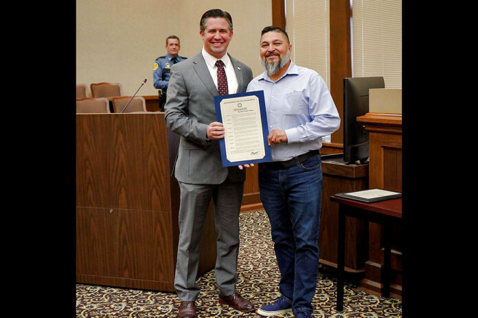 Montgomery County Mayor Wes Golden and Catarino Guzman