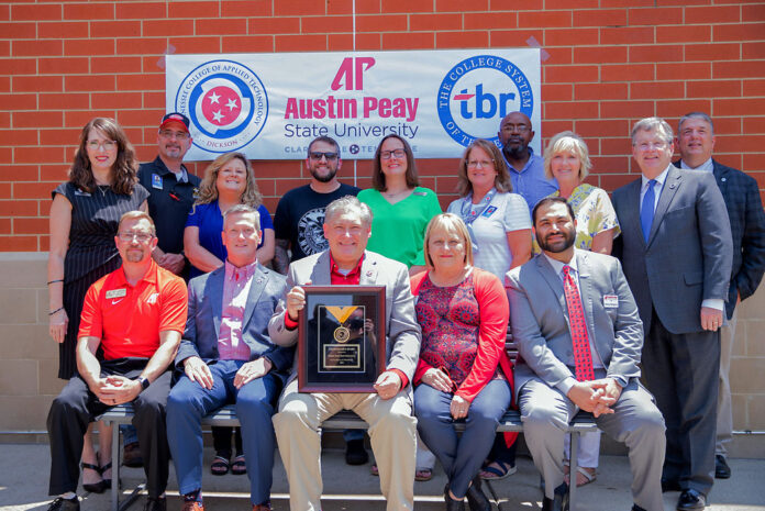 Dr. Mike Licari, Austin Peay State University president, accepts the Chancellor's Award for Excellence in Philanthropy from TCAT Dickson on behalf of the University. (APSU)