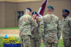 Blanchfield Army Community Hospital Commander Col. Vincent B. Myers passes the unit colors to Lt. Col. Clarisa Horton Friday, June 23rd during the Fort Campbell Soldier Recovery Unit Change of Command, where Lt. Col. Joseph Reagan relinquished command to Horton.