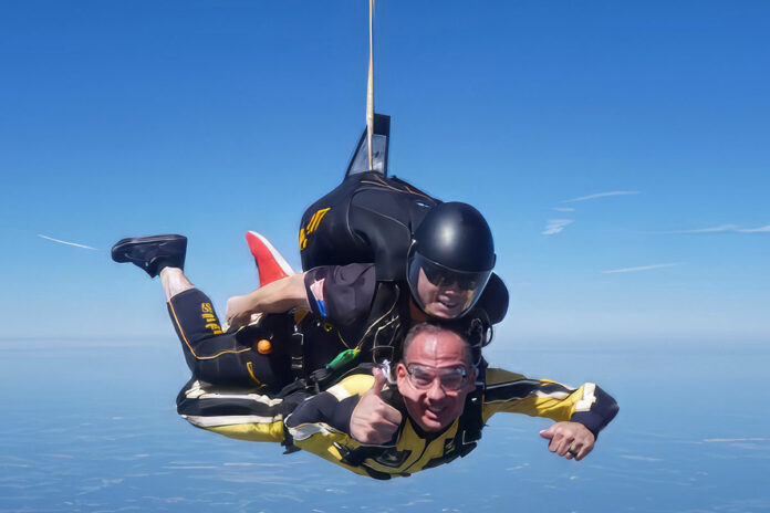 Austin Peay State University's Kris Phillips during a tandem jump with the U.S. Army Parachute Team. (U.S. Army photo by 7th BDE ROTC.)