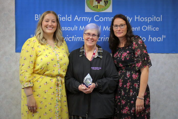 Evangeline Barefoot, BACH Forensic Healthcare Program Manager, center, was named International Association of Forensic Nurses Front Line Forensic Nurse of the Year, July 17, during a presentation on Fort Campbell, Kentucky. Also shown Olivia Hobbs, IAFN, left, and Jessica Lietz, BACH acting Chief of Ambulatory Care. (Justin Moeller, Blanchfield Army Community Hospital)