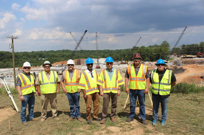 Shown from left at the construction site are: Mark Riggins, Clarksville Gas & Water, General Manager; Steve Sandlin, Judy Construction, Site Superintendent; Chris Lambert, Clarksville Water Operations Division Manager; James Halford, City of Clarksville, Chief of Staff; Joe Pitts, City of Clarksville, Mayor; Chris Cherry, Clarksville Assistant Water Operations Division Manager; and Randall Gillum, Clarksville Water Treatment Plant Assistant Manager.