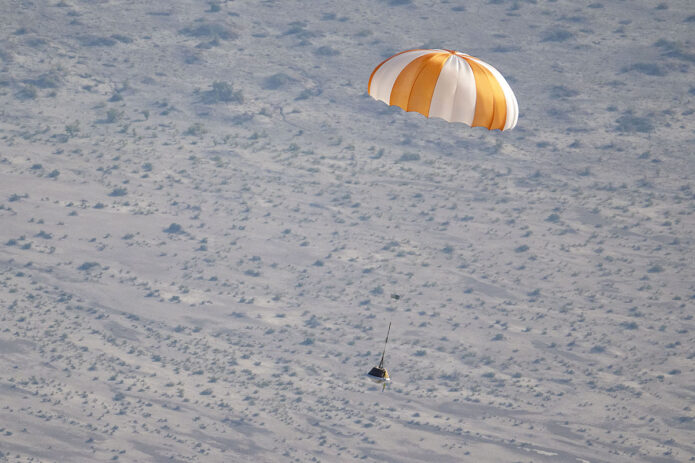 A training model of the sample return capsule is seen during a drop test in preparation for the retrieval of the sample return capsule from NASA's OSIRIS-REx mission, Wednesday, Aug. 30, 2023, at the Department of Defense's Utah Test and Training Range. The sample was collected from asteroid Bennu in October 2020 by NASA’s OSIRIS-REx spacecraft and will return to Earth on September 24th, landing under parachute at the Utah Test and Training Range. (NASA/Keegan Barber)