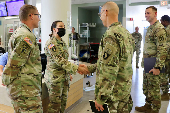 101st Airborne Division (Air Assault) and Fort Campbell Commanding General Maj. Gen. Brett G. Sylvia greets Blanchfield Army Community Hospital Emergency Center’s Clinical Nurse Officer in Charge Maj. Chelsi Hennessey and Emergency Medicine Physician Maj. Josef Jessop (left), during a visit to BACH August 29th. Hospital Commander Col. Sam Preston (right) led a tour for the division’s command team to learn more about BACH’s mission and capabilities, and support to the division.