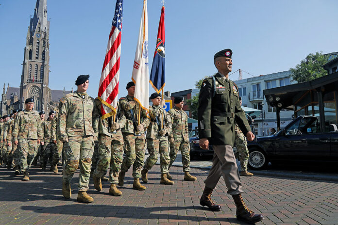 1st Brigade Combat Team, 101st Airborne Division (Air Assault) commander Col. Trevor Voelkel with his Soldiers marching to the Operation Market Garden Memorial. (Sgt. Caleb Pautz, 101st Airborne Division (Air Assault))