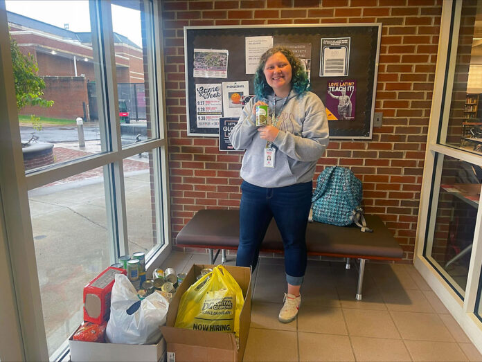 Austin Peay State University student Emma Matlock with some of the donations she has collected for Maui at the Honors Commons. (APSU)