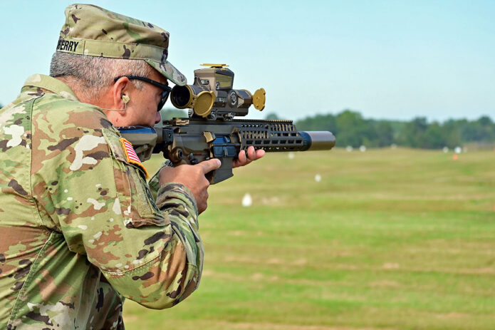 U.S. Army Fort Campbell Garrison Commander Col. Christopher Midberry fires a Next-Generation Squad Weapon (NGSW) Machine Gun during a weapon familiarization demonstration, Sept. 25, 2023, at Fort Campbell, Ky. Both the XM7 Rifle and the XM250 Automatic Rifle are primed to replace their predecessors, the 5.56mm caliber M4s and M249 SAWs, and introduce a slew of advancements in military firepower. (Kayla Cosby)
