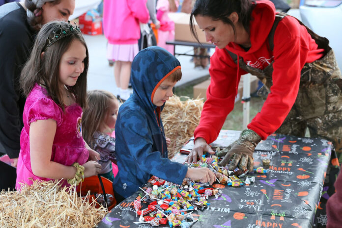 Families explore creatively decorated trunks filled with candy and delight at Hilltop Supermarket's annual Trunk or Treat event, a heartwarming Halloween tradition for the community south of the river. (Mark Haynes, Clarksville Online)