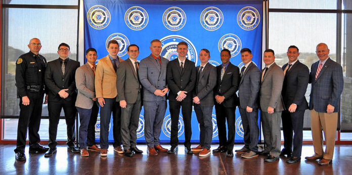 (L-R) Clarksville Police Chief David Crockarell, Isaac Barretto, Khristian Harris-Lusk, Sam Hill, Brandon Horn, Michael Laws, Gabriel Price, Brent Read, Kashime Saunders, Nicholas Traystman, William Thompson, Erik Wichaa, and Clarksville Mayor Joe Pitts.