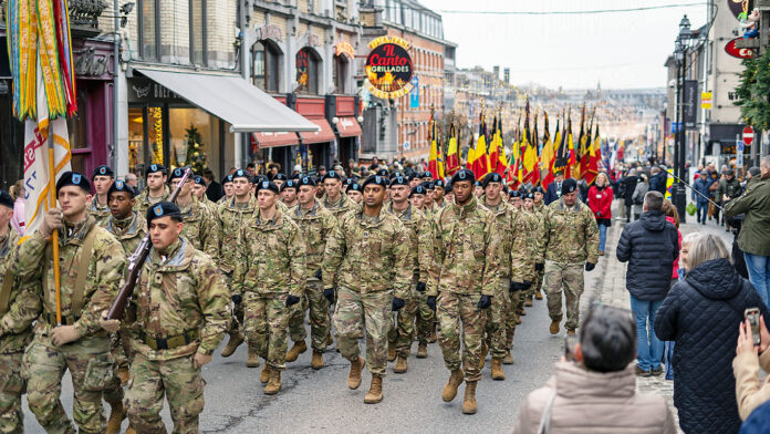 To celebrate the 79th anniversary of the Battle of the Bulge, the city of Bastogne, Belgium hosted a parade through the city on Dec. 16, 2023. Soldiers of the 101st Airborne Division (Air Assault) marched with WWII veterans, a local band, members of the Belgian military, Soldiers from Benelux, Belgian school children, and members of the community. (Staff Sgt. Joshua Joyner, 101st Airborne Division (Air Assault)