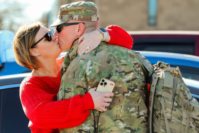 A Tennessee National Guardsman, with the Memphis based 730th Composite Supply Company, embraces a family member, Dec. 14, at Smyrna’s Volunteer Training Site after returning from a successful 10-month deployment overseas. (Cpl. Kalina Hyche)