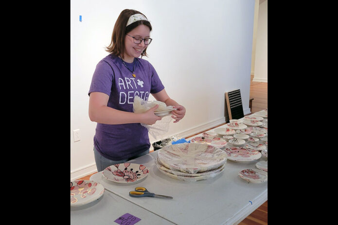 Austin Peay State University art student Rheanne Bouchard works on an installation. (APSU)
