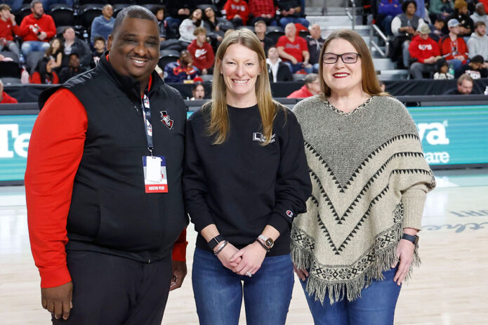 Austin Peay State University Vice President and Athletics Director Gerald Harrison was joined on-court by Mayer Marks (LifePoint Church) and Debbie Fields (YAIPak Outreach) in recognition of their efforts to organize Clarksville tornado relief efforts. (Robert Smith, APSU Sports Information)