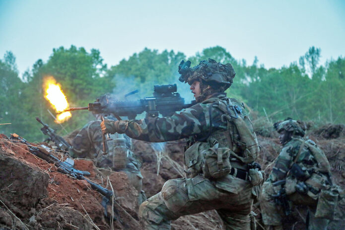 A Soldier with 1st Brigade Combat Team, 101st Airborne Division (Air Assault) fires blanks while acting as opposing force (OPFOR) during an engagement with 2nd Brigade Combat Team,101st Airborne Division (Air Assault), as part of Operation Lethal Eagle 24.1, April 25, 2024, Fort Campbell KY. (Spc. Zachery Blevins, 101st Airborne Division (Air Assault))