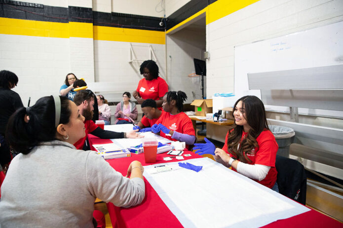Students from the Ausitn Peay State University Department of Health and Human Performance provide a variety of health screenings and tests for the community during the 2024 Wellness Hub. (Madison Casey, APSU)