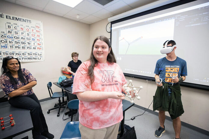 Dr. Anuradha Pathiranage, assistant professor of chemistry, works with students from the College of STEM on an interdisciplinary VR project. (L to R) Pathiranage, Calleway Schmidt, Ashton Cromwell and Owen Fink. (Ally Shemwell, APSU)
