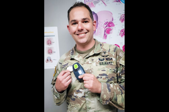 Blanchfield Army Community Hospital Chief of Otolaryngology Maj. Alexander Lanigan poses with the only current FDA approved device assisted upper airway stimulation therapy for the Defense Health Network, East region. (Justin Moeller, BACH)