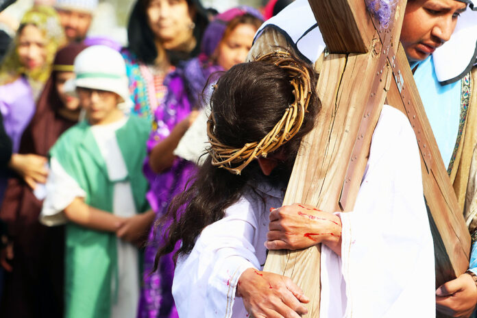 Jesus is helped by Cyrus of Cyrene.