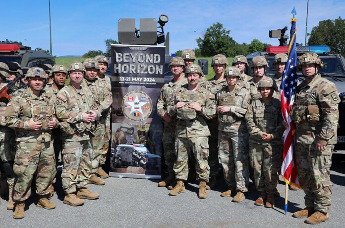 Tennessee Guardsmen from Athens’ 117th Military Police Battalion and Murfreesboro’s 269th Military Police Company pose for a group photograph following the opening ceremony for Beyond Horizon 2024, a multi-national training exercise held at Bulgaria’s Novo Selo Training Site, May 14. These Soldiers will train with more than 140 military policemen from Bulgaria, Canada, Greece, North Macedonia, and Romania during the nine-day exercise to improve multi-national teamwork and combat skills. (Lt. Col. Darrin Haas)