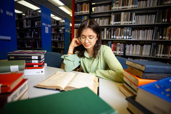 Austin Peay State University alumna Patricia Angel immerses herself in a study session at the Woodward Library. (Sean McCully, APSU)