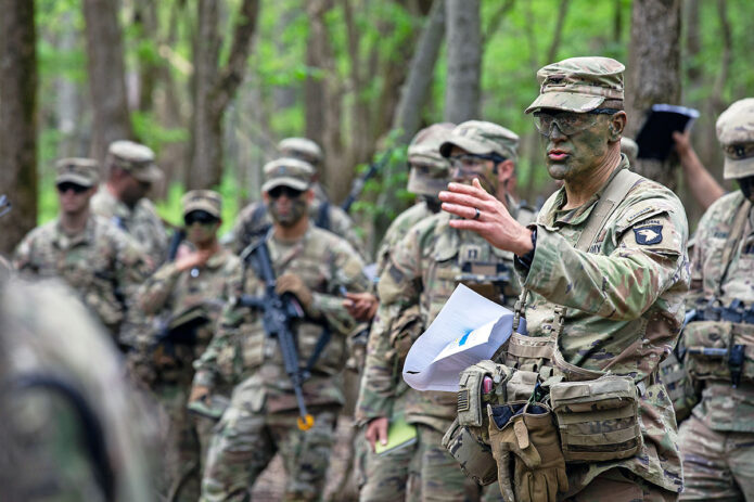 Col. James Stultz, brigade commander of 2nd Brigade Combat Team (Strike), 101st Airborne Division (Air Assault) briefs Strike key leaders during a combined arms rehearsal prior to assaulting objective Titan during Operation Lethal Eagle 24.1 at Fort Campbell, KY., April 25th, 2024. (Sgt. Caleb Pautz, 101st Airborne Division (Air Assault))