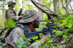 Pfc. Martin Martinez, a senior scout observer assigned to Multi Functional Reconnaissance Company, 2nd Brigade Combat Team, 101st Airborne Division (Air Assault), and Pvt. Necho Frias, a scout observer assigned to Multi Functional Reconnaissance Company, 2nd Brigade Combat Team, 101st Airborne Division (Air Assault), conduct reconnaissance on an enemy position during Operation Lethal Eagle 24.1 at Fort Campbell, KY, April 27th 2024. (Sgt. Caleb Pautz, 101st Airborne Division (Air Assault))