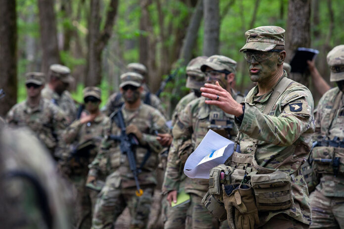 Col. James Stultz, brigade commander of 2nd Brigade Combat Team (Strike), 101st Airborne Division (Air Assault) briefs key leaders during a combined arms rehearsal prior to assaulting objective Titan during Operation Lethal Eagle 24.1 at Fort Campbell, KY, April 25th, 2024. (Sgt. Caleb Pautz, 101st Airborne Division (Air Assault))