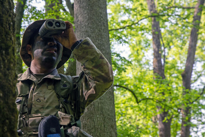 Pfc. Martin Martinez, a senior scout observer assigned to Multi Functional Reconnaissance Company, 2nd Brigade Combat Team, 101st Airborne Division (Air Assault), conducts reconnaissance on an enemy position during Operation Lethal Eagle 24.1 at Fort Campbell, KY, April 26th, 2024. (Sgt. Caleb Pautz, 101st Airborne Division (Air Assault))