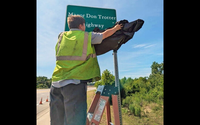 Signage is unveiled designating Mayor Don Trotter Highway