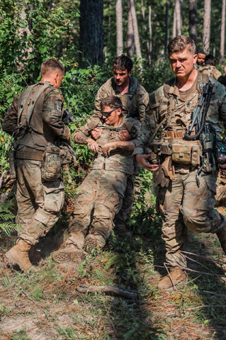 Soldiers from the 2nd Mobile Brigade Combat Team, 101st Airborne Division (Air Assault) take part in a medical training simulation, reacting to contact and treating casualties at the Joint Regional Training Center (JRTC) at Ft. Johnson, LA on August 18th, 2024. (Staff Sgt. Joshua Joyner, 101st Airborne Division)
