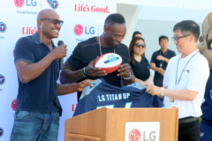 Keith Bulluck and Jevon Kearse presented an autographed football to the people of LG Electronics