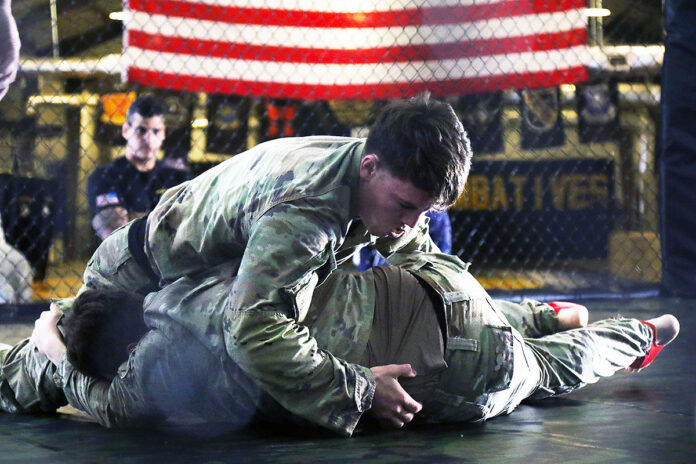 Soldiers, assigned to the 101st Airborne Division (Air Assault), spar one another during a combatives elimination round hosted by The Sabalauski Air Assault School (TSAAS) Combatives Program at Fort Campbell, Ky., Sept. 26, 2024. The event was part of a three-day tournament to determine which Soldiers will be selected for the TSAAS Combatives Team in preparation for the XVIII Airborne Corps Combatives Invitational at Fort Liberty, NC. (Spc. Mary Louise Esguerra)