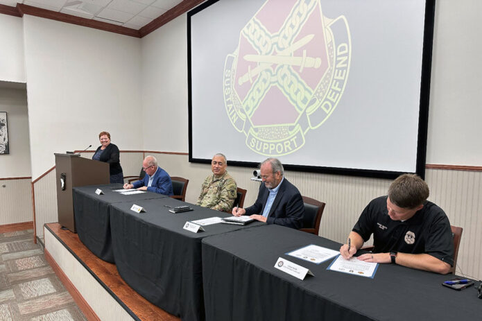 (L to R) James Knight Jr., Mayor of the City of Hopkinsville, Ky.; Fort Campbell Garrison Commander Colonel Christopher Midberry; Eston Glover, Chairman of the Pennyrile Regional Energy Agency; and Adam Smith, Jailer at the Christian County Jail sign three Intergovernmental Support Agreements to benefit both Fort Campbell and the community partner’s organizations and communities.
