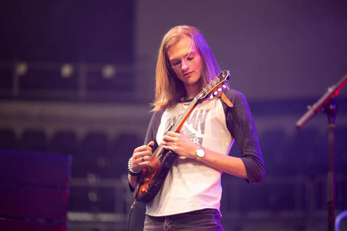 APSU alum Channing Wright performs with Fiddlin’ Peayple at F&M Bank Arena. Wright was one of the ensemble’s original members and coined its name. (Sean McCully)
