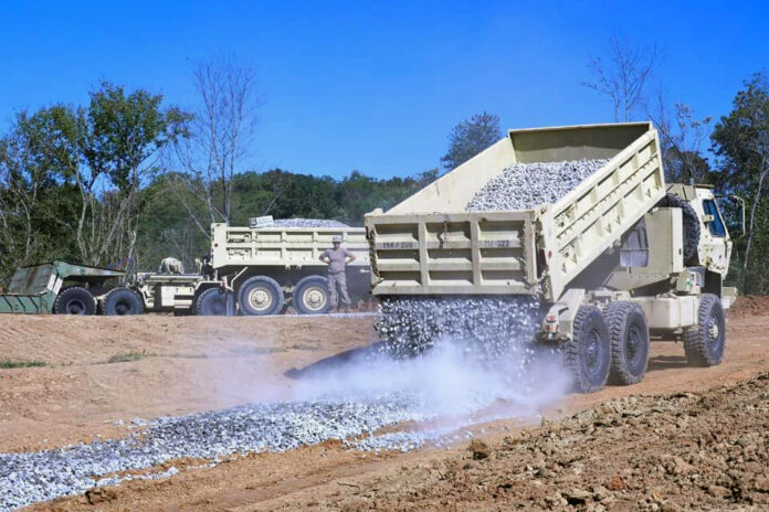 Engineers with the Tennessee National Guard’s Joint Task Force Castle assist with road construction in Greeneville, October 8. (Sgt. Olivia Gum)