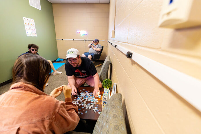 Students enrolled in the Full Spectrum Learning program at Austin Peay State University engage in the new sensory room that opened this fall. The space, the first of its kind at APSU, provides activities and items to help neurodivergent students relax and focus. (Sean McCully, APSU)