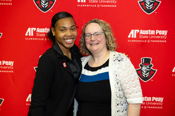 Jasmine Lewis, a first-generation student and elementary education major at Austin Peay State University, poses with one of her favorite professors, Dr. Joanne Philhower, after a Spring 2024 award ceremony on campus. (APSU)