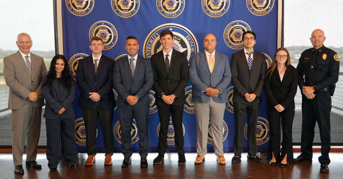 (L-R) Clarksville Mayor Joe Pitts, Teresa Camp, Gabriel Howard, Nicholas Domingos, Dawson Darnell, Nathaniel Elliott, Daniel Riley, Angel Rushton, and Clarksville Police Chief David Crockarell.
